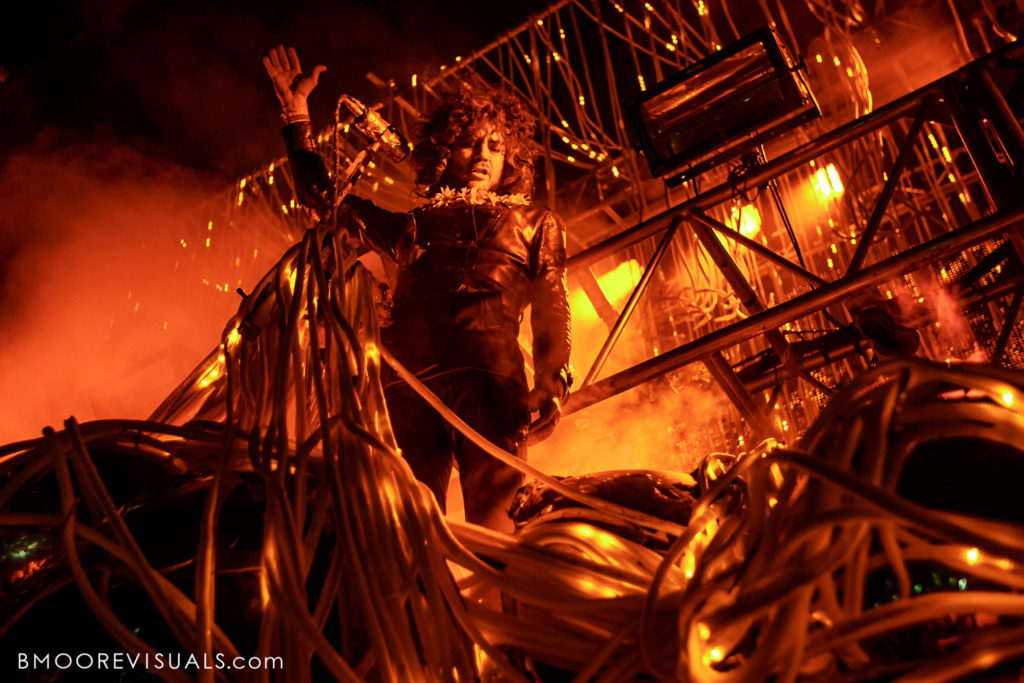 Wayne Coyne of The Flaming Lips performs in an onslaught of red light at Gasparilla Music Festival in Tampa, Florida