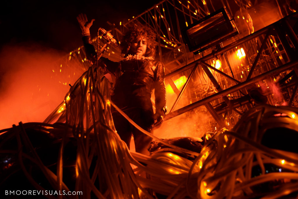 Wayne Coyne of The Flaming Lips performs in an onslaught of red light at Gasparilla Music Festival in Tampa, Florida