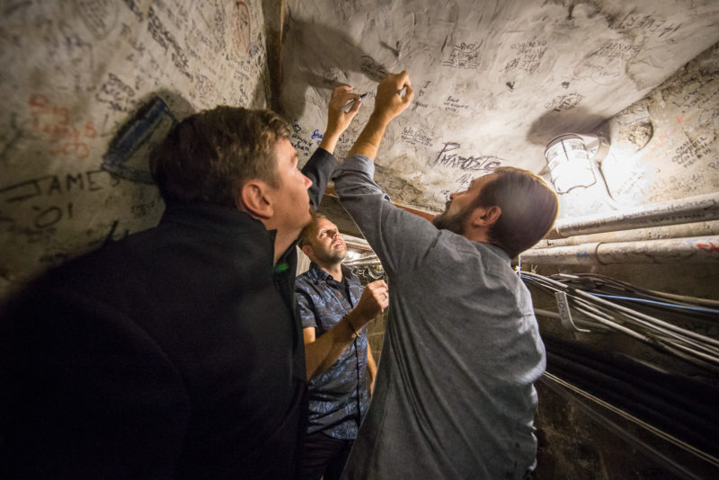 Mark Lee, David Carr, and Mac Powell of Third Day sign the tunnel at Red Rocks Amphitheater in Morrison, Colorado on June 14, 2015