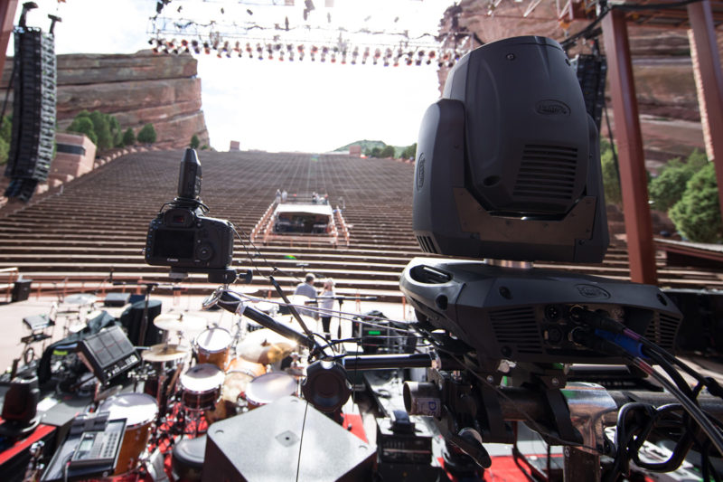 Canon 5D Mark III with 14mm f/2.8 lens and PocketWizard Plus III set up on a Manfrotto variable friction Magic Arm as a remote camera on a Manfrotto variable friction Magic Arm behind Third Day's drum kit on June 14, 2015 at Red Rocks Amphitheater in Morrison, Colorado