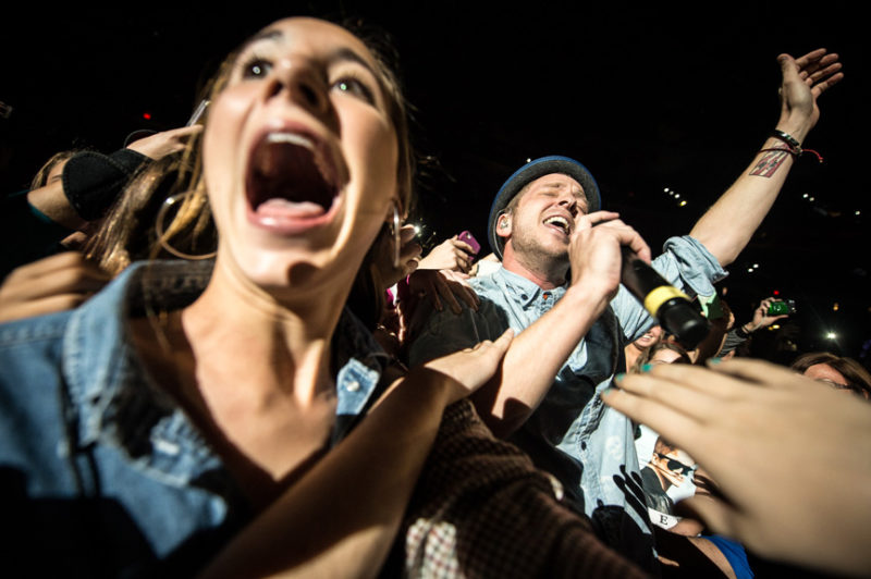 Ryan Tedder of OneRepublic sings to fans in the crowd during 93.3 FLZ's Jingle Ball in Tampa, Florida