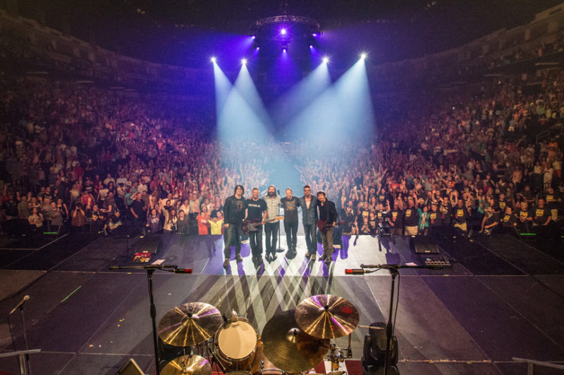 Brian Bunn, Tai Anderson, Mac Powell, David Carr, Scotty Wilbanks, and Mark Lee of Third Day pose with the sold out crowd at Infinite Energy Center in Atlanta at the end of the show