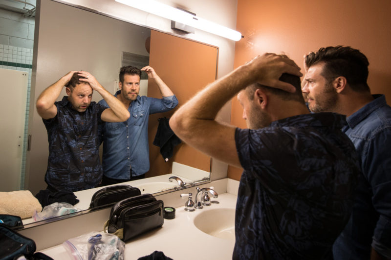 David Carr and Scotty Wilbanks of Third Day get ready backstage on June 14, 2015 at Red Rocks Amphitheater in Morrison, Colorado