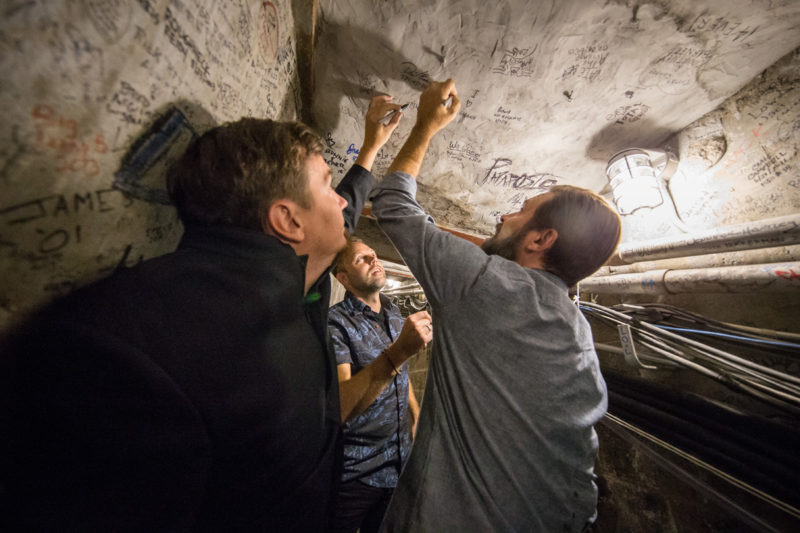 Mark Lee, David Carr, and Mac Powell of Third Day sign the tunnel on June 14, 2015 at Red Rocks Amphitheater in Morrison, Colorado