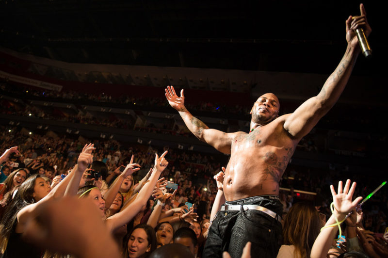 Flo Rida stands in the crowd with fans during Y100's Jingle Ball in Miami, Florida