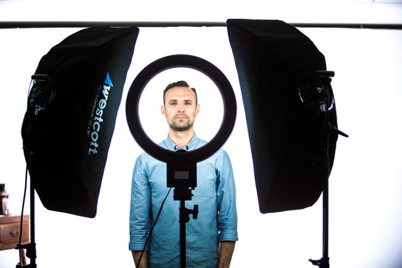 Photo showing ring light and strip bank constant light setup for portraits