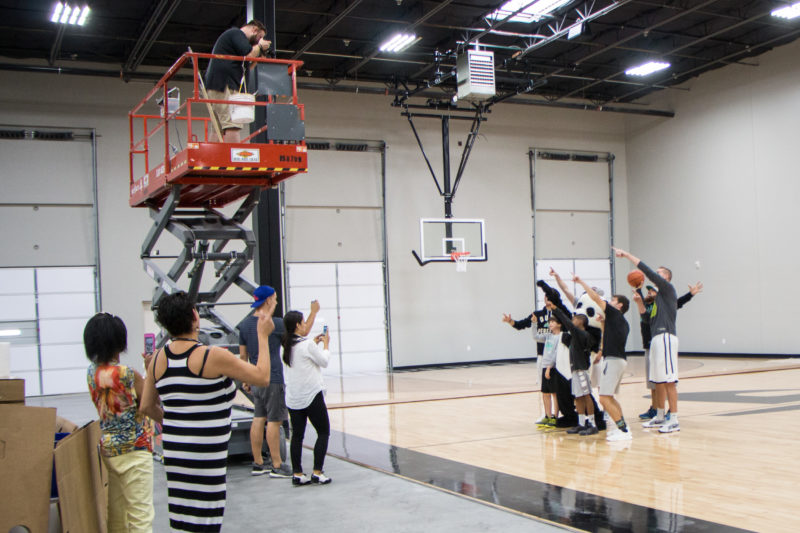 Brad Moore photographs Dude Perfect on the basketball court at their headquarters in Frisco, Texas