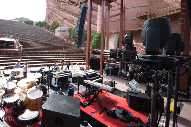 Canon 5D Mark III with 14mm f/2.8 lens and PocketWizard Plus III set up as a remote camera on a Manfrotto variable friction Magic Arm behind Third Day's drum kit on June 14, 2015 at Red Rocks Amphitheater in Morrison, Colorado